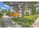 Inviting two-story home featuring a well-maintained lawn, mature trees, and a charming walkway at 5150 Buckingham Rd, Boulder, CO 80301