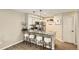Stylish kitchen with stainless steel appliances, granite countertops, and seating for four at the breakfast bar at 5150 Buckingham Rd, Boulder, CO 80301