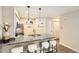 Bright kitchen featuring a gray granite countertop, stainless steel appliances, and modern pendant lighting at 5150 Buckingham Rd, Boulder, CO 80301