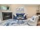 Elegant living room boasting a cozy fireplace and stylish decor at 5150 Buckingham Rd, Boulder, CO 80301