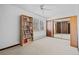 Spacious bedroom with a built-in bookcase and a ceiling fan at 2490 S Lima St, Aurora, CO 80014