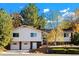 Ranch style home with brick facade and attached two-car garage at 2490 S Lima St, Aurora, CO 80014