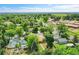 Neighborhood aerial view showcases the home's prime location with mature trees and surrounding community amenities at 485 S Pierson St, Lakewood, CO 80226