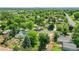 Neighborhood aerial view highlighting lush green surroundings, mature trees, and the home's location at 485 S Pierson St, Lakewood, CO 80226