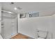 Clean, partially finished basement bathroom with a toilet and glass shower stall at 485 S Pierson St, Lakewood, CO 80226