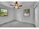 Inviting bedroom offers cozy carpet, neutral paint and a bright atmosphere with large windows at 485 S Pierson St, Lakewood, CO 80226