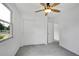 Neutral bedroom with gray carpet, a window, and white closet doors at 485 S Pierson St, Lakewood, CO 80226