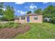 Charming single-story home with a well-maintained lawn, blue door, and colorful landscaping in front at 485 S Pierson St, Lakewood, CO 80226