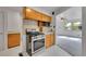 Kitchen leads to living room, showing stainless oven and microwave at 485 S Pierson St, Lakewood, CO 80226