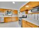 Functional kitchen features stainless steel appliances, ample cabinetry, and plenty of counter space at 485 S Pierson St, Lakewood, CO 80226