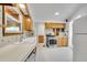 Bright kitchen boasts updated appliances, white countertops, and tiled backsplash for a modern feel at 485 S Pierson St, Lakewood, CO 80226