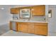 Kitchen features updated appliances, ample counter space, and functional layout at 485 S Pierson St, Lakewood, CO 80226