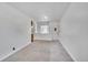 Bright living space featuring new carpet, an open doorway, and fresh paint at 485 S Pierson St, Lakewood, CO 80226