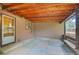 Covered back patio featuring a colorful tiled floor and exposed wood ceiling at 485 S Pierson St, Lakewood, CO 80226