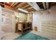 Unfinished basement with workbench and storage, ready for your customization and projects at 14139 W Warren Dr, Lakewood, CO 80228