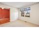 Bright bedroom with closet and large window offering a pleasant view at 14139 W Warren Dr, Lakewood, CO 80228