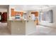 Bright eat-in kitchen with an island, stainless steel appliances, and a window with natural light at 14139 W Warren Dr, Lakewood, CO 80228
