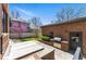 Backyard featuring a patio, built-in grill, manicured landscaping, and privacy at 1131 S York St, Denver, CO 80210