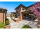 Inviting backyard with a patio, hot tub, blooming tree and well-manicured lawn, perfect for outdoor entertaining at 1131 S York St, Denver, CO 80210