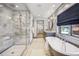 Lovely bathroom featuring glass shower, soaking tub, and large windows, creates a spa-like retreat at 1131 S York St, Denver, CO 80210