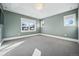 Spacious bedroom with a tray ceiling, natural light, and a modern design at 1131 S York St, Denver, CO 80210