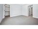 Bright bedroom with gray carpet and a spacious closet at 1131 S York St, Denver, CO 80210