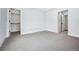 Bedroom features closet and en suite bathroom. Neutral walls and carpet allows for personalization at 1131 S York St, Denver, CO 80210