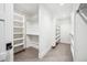 Spacious walk-in closet with ample shelving and hanging space at 1131 S York St, Denver, CO 80210