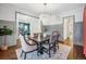 Elegant dining room features hardwood floors, gray walls, and a modern chandelier at 1131 S York St, Denver, CO 80210