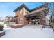 Rear exterior elevation of home showcases brick construction, patio area and convenient access to a spa at 1131 S York St, Denver, CO 80210