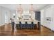 Spacious kitchen with large island, marble countertop, seating, stainless steel appliances and hardwood floors at 1131 S York St, Denver, CO 80210