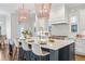 Modern kitchen with a center island, white and blue cabinets, and marble countertops at 1131 S York St, Denver, CO 80210