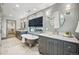 Elegant bathroom featuring a clawfoot tub, dual marble vanities, and herringbone tile floors at 1131 S York St, Denver, CO 80210