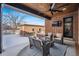 Covered patio with comfortable seating and a built-in TV at 1131 S York St, Denver, CO 80210