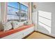 Built-in window seat with comfortable cushions and pillows at 1131 S York St, Denver, CO 80210