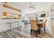 Open concept dining area with breakfast bar and hardwood floors at 990 S Locust St # D, Denver, CO 80224