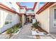 Inviting entryway with a walkway leading to a double door entrance at 990 S Locust St # D, Denver, CO 80224