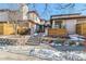 Attractive exterior of a townhome with a walkway and landscaping at 990 S Locust St # D, Denver, CO 80224