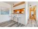 Kitchen features a breakfast bar and modern cabinetry at 990 S Locust St # D, Denver, CO 80224