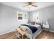 Bright bedroom with hardwood floors, natural light, and modern decor at 6980 Niagara St, Commerce City, CO 80022