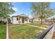 Charming home with a freshly painted exterior and a cozy front porch and fenced yard at 6980 Niagara St, Commerce City, CO 80022