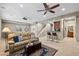 Relaxing basement area with a wet bar and comfortable seating at 9382 Pike Way, Arvada, CO 80007
