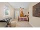 Comfortable bedroom with carpet floors, a ceiling fan and natural light at 9382 Pike Way, Arvada, CO 80007