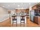 Spacious kitchen with stainless steel appliances and hardwood floors at 9382 Pike Way, Arvada, CO 80007