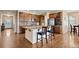 Modern kitchen featuring granite countertops, a kitchen island, and stainless steel appliances at 9382 Pike Way, Arvada, CO 80007