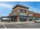Restaurant and bar with outdoor seating, brick and stone facade, and convenient parking at 9382 Pike Way, Arvada, CO 80007