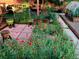 Backyard with flowers, patio seating and garden at 1695 S Beach Ct, Denver, CO 80219