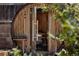 View of the barrel sauna, featuring wood construction and glass door entry at 1695 S Beach Ct, Denver, CO 80219