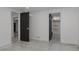 Unfinished basement with black doors and concrete floors offers design potential at 1695 S Beach Ct, Denver, CO 80219
