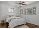 Bright bedroom with hardwood floors, large window and neutral decor at 1695 S Beach Ct, Denver, CO 80219